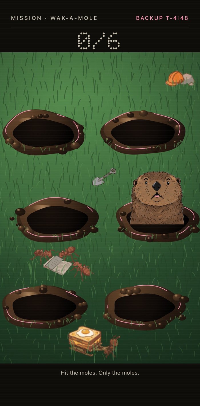 The Wak-a-Mole mission in Mission Alarm, showing burrows on a felt lawn and a mole mid-hit